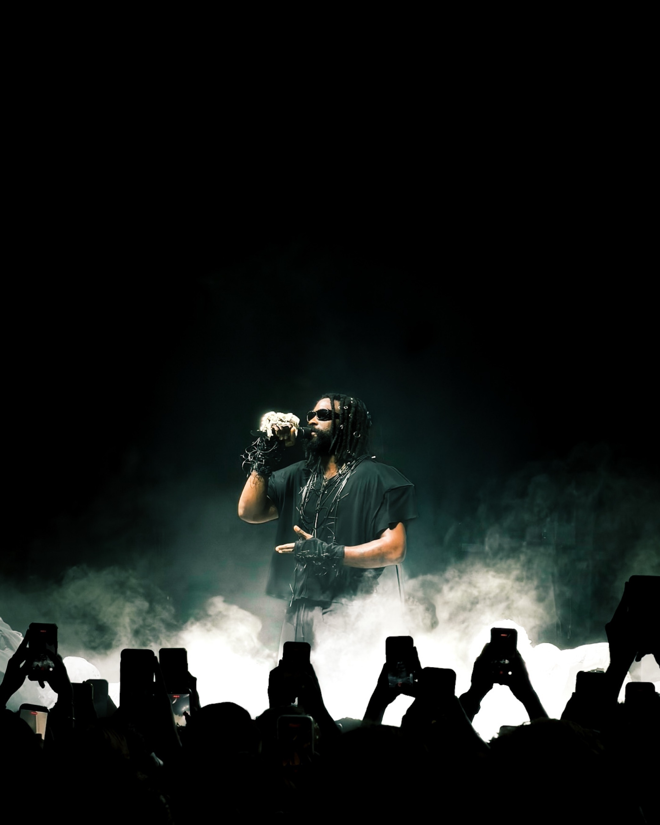 Singer emerging from stage smoke